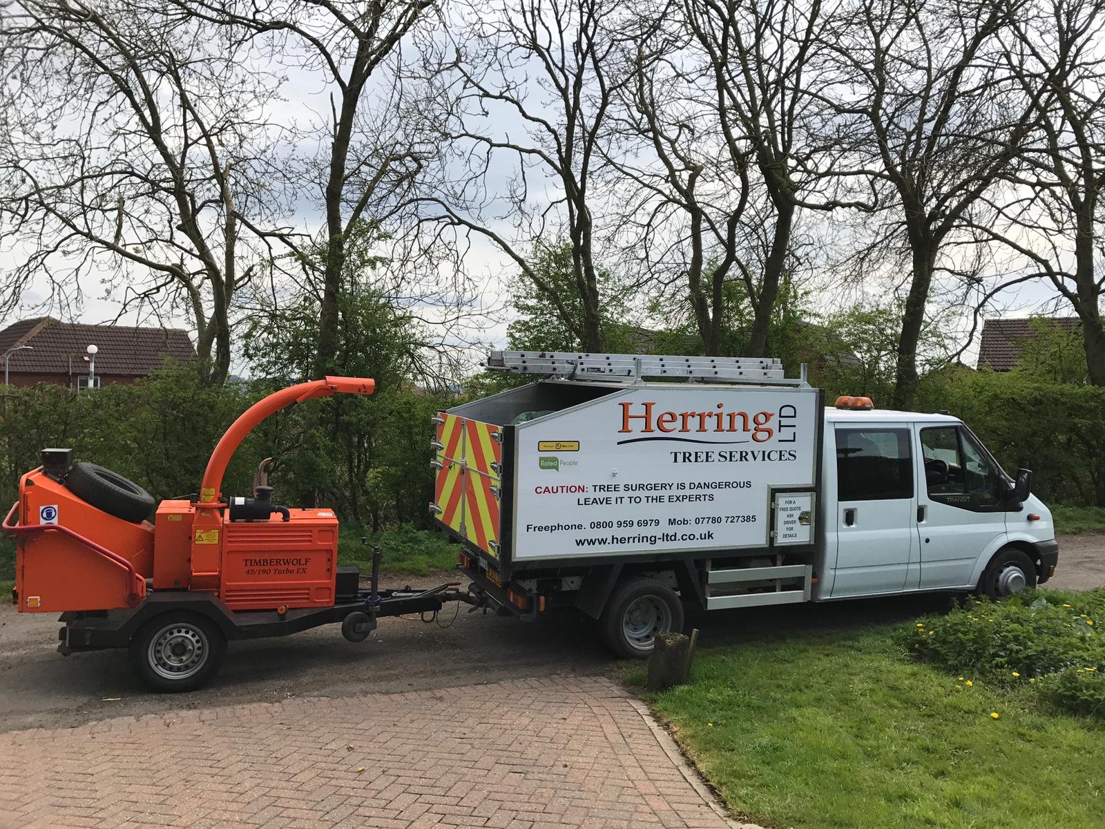 Herring Ltd liveried tree services van and Timberwolf wood chipper on site